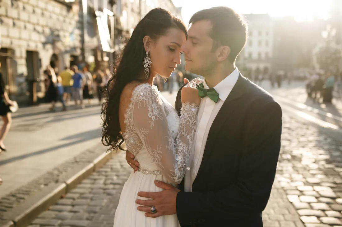 Newlyweds outside a classical building