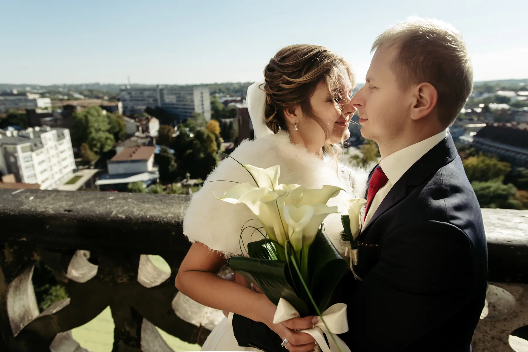 A happy wedding couple sharing a moment at sunset