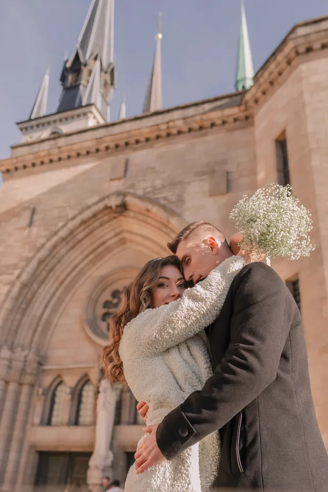 A couple walking through a European street