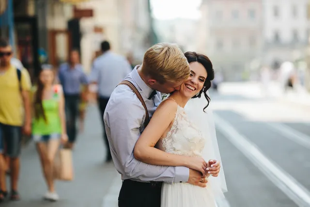 A bride resting on her partner's shoulder